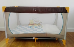 Playpen with safety net and padded floor, perfect for little ones to play and explore.