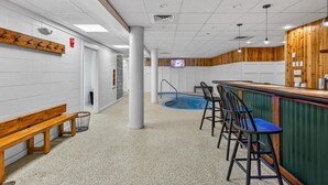 A pool area with a bar and seating. - Pinnacle B09 (Killington)