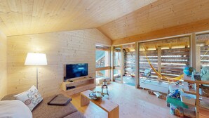 Living area - Stylish architect’s hut at the ski lift (Obermutten)