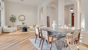 A spacious living area with a dining table, multiple chairs, a coffee table, and a large vase. - Scottsdale Vacation Rental w/ Heated Saltwater Pool, Near Kierland, Golf & Spring Training (Scottsdale)