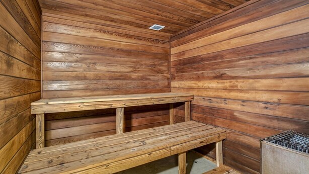 A wooden sauna with benches and a ventilation system. - Pinnacle D23 (Killington)
