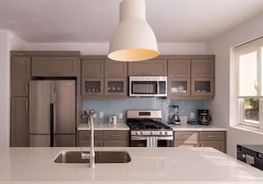 Fridge, cookware/dishes/utensils, dining tables