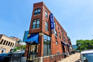 Located in a street-level setting, 747 LOFTS features large windows and a modern facade.