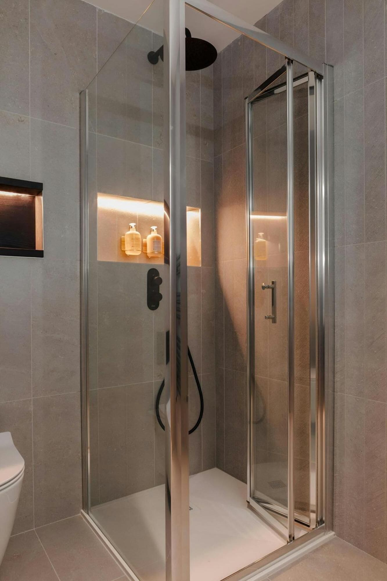 Shower, rainfall showerhead, designer toiletries, hair dryer