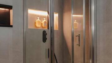 Shower, rainfall showerhead, designer toiletries, hair dryer