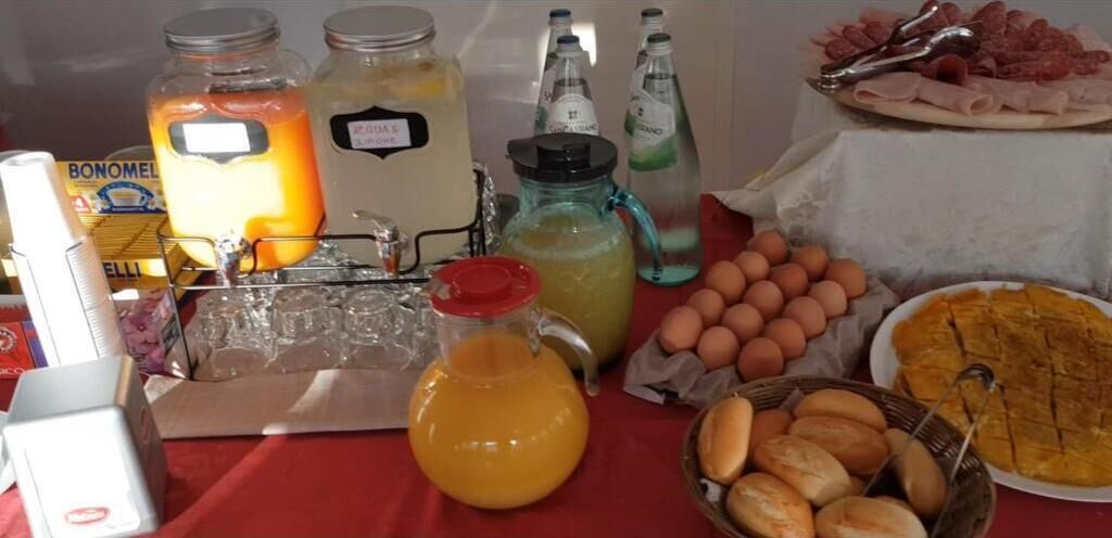 A breakfast buffet with various food items and beverages.