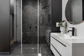 Shower, hair dryer, towels, soap