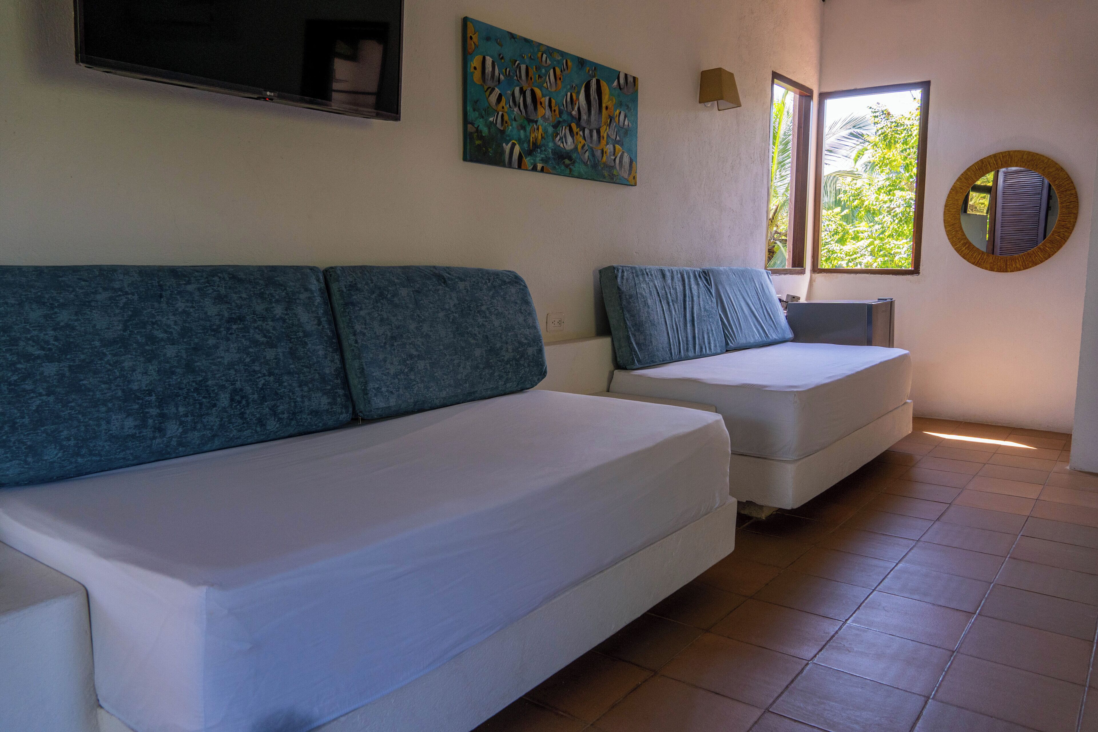 Deluxe suite, uitzicht op zee | Een kluis op de kamer, gratis wifi