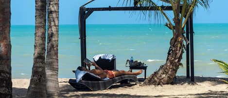 On the beach, beach umbrellas, beach towels, beach massages