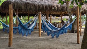 On the beach, beach umbrellas, beach towels, beach massages - coconuco beach palomino (Dibulla)