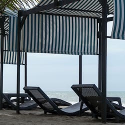 On the beach, beach umbrellas, beach towels, beach massages