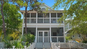 A two-story house with a porch, surrounded by a white picket fence, and a sign indicating a historical landmark. - 5 Mins to Seaside Beach, Prime Location, Amazing Porches + 2 Adult Bikes! (Santa Rosa Beach)