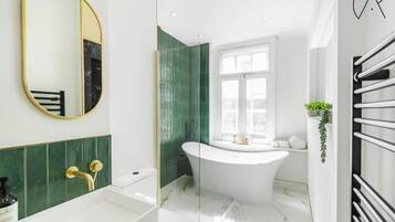 Bathtub, hair dryer, towels