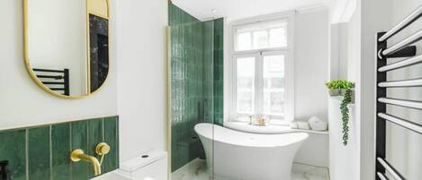 Bathtub, hair dryer, towels
