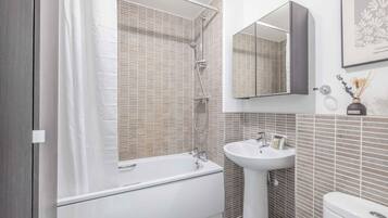 Bathtub, hair dryer, towels