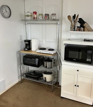 Fridge, microwave, coffee/tea maker, toaster