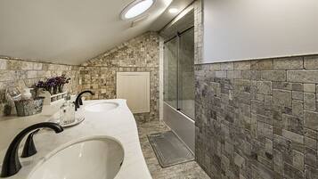 Combined shower/bathtub, towels, soap, toilet paper