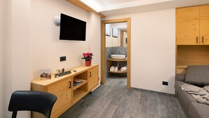 A modern bathroom with a wooden vanity, a sink, and a mirror. - Apartment "Stelo Rosina's Home" (Livigno)