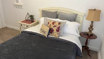 1 bedroom, desk, iron/ironing board, travel crib