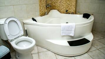 Bathtub, hair dryer, bidet, towels