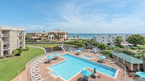 A resort with a large pool, a water feature, and a view of the ocean. - Gulf and Pool Views, Free Seasonal Beach Service, Designated Beach Area on 30A!! (Santa Rosa Beach)