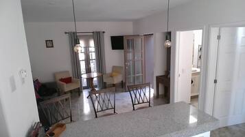 Family Villa | Living area | 42-inch flat-screen TV with cable channels, TV