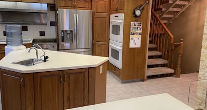 Large family or group vacation lake home with dock and boats 35 minutes from WEM