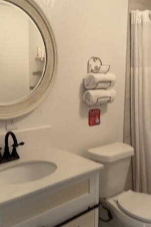 Combined shower/bathtub, hair dryer, towels, soap