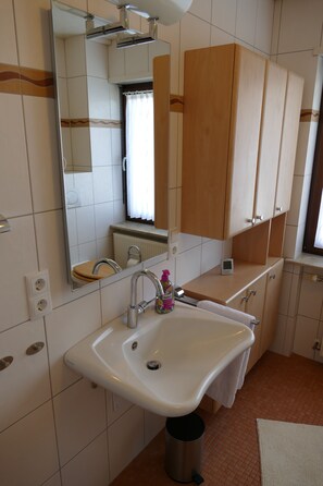 Shower, free toiletries, hair dryer, slippers