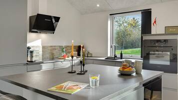 Fridge, stovetop, dishwasher, coffee/tea maker