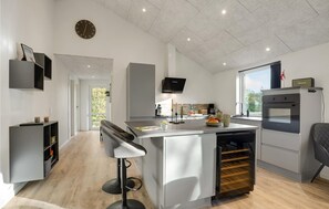 Fridge, stovetop, dishwasher, coffee/tea maker