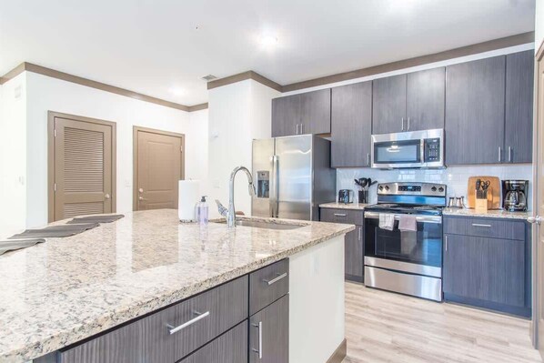 Fridge, microwave, oven, stovetop - Boulevard Stays Charming 2BR Retreat Pool, Parking, Gym (Middletown)