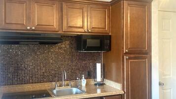 Fridge, microwave, stovetop, coffee/tea maker