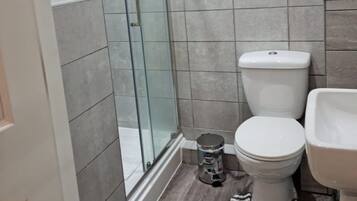 Combined shower/tub, hair dryer, towels, soap