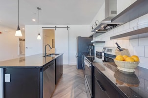 One-Bedroom Suite | Private kitchen | Full-size fridge, electric kettle, freezer, dining table