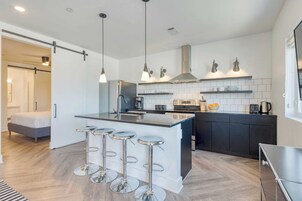 One-Bedroom Suite | Private kitchen | Full-size fridge, electric kettle, freezer, dining table