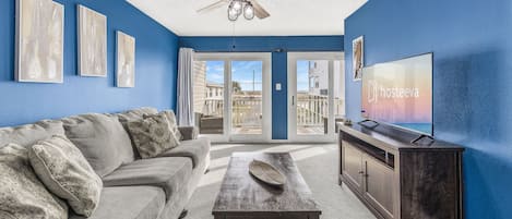 Family House, 3 Bedrooms, Balcony | Living room | 50-inch Smart TV with cable channels, TV