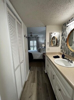 Combined shower/bathtub, hair dryer, towels, toilet paper