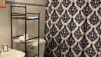 Shower, towels, soap, toilet paper
