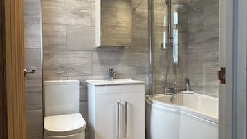 Combined shower/tub, hair dryer, towels, soap