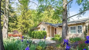 A house surrounded by a garden with various plants and flowers. - [Egg Farm Ranch] Heated Pool - Water Slide - Hot Tub - Dog Friendly (Kenwood)