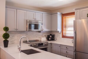 Fridge, microwave, oven, stovetop - #13 Treeline Stylish 3 bedroom townhome located slope side on Blackcomb Mountain (Whistler)