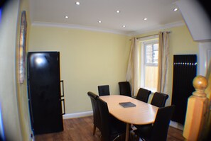 Enjoy meals in this cozy dining area with a table and six chairs.