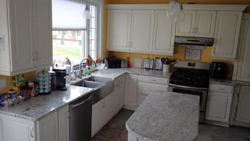 Fridge, microwave, coffee/tea maker, cookware/dishes/utensils