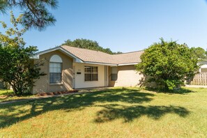 Stroll through the shaded grounds of this charming single-story home, featuring a cozy front porch and a spacious extension.