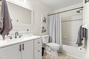 Combined shower/tub, hair dryer, towels, soap