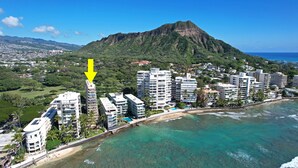 A coastal resort area with high-rise hotels, a beach, and a mountain in the background. - Remodeled in 2022, Diamond Head 2 Bedroom Oceanfront condo (Honolulu)