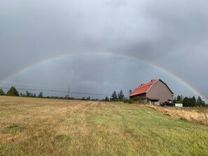 A rural landscape with a barn and a rainbow. - Beautiful beachfront Villa on 80 acres of farmland! (Sooke)