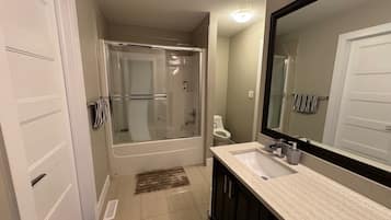 Bathtub, hair dryer, towels, soap