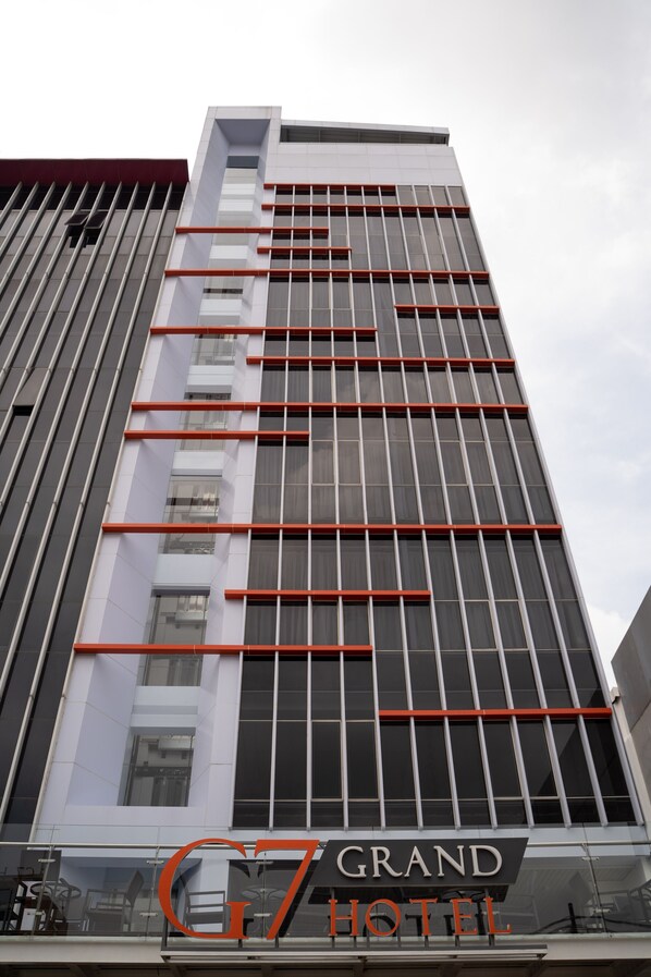A modern hotel building with a prominent 'G7 GRAND HOTEL' sign. - Grand G7 Pasar baru (Jakarta)